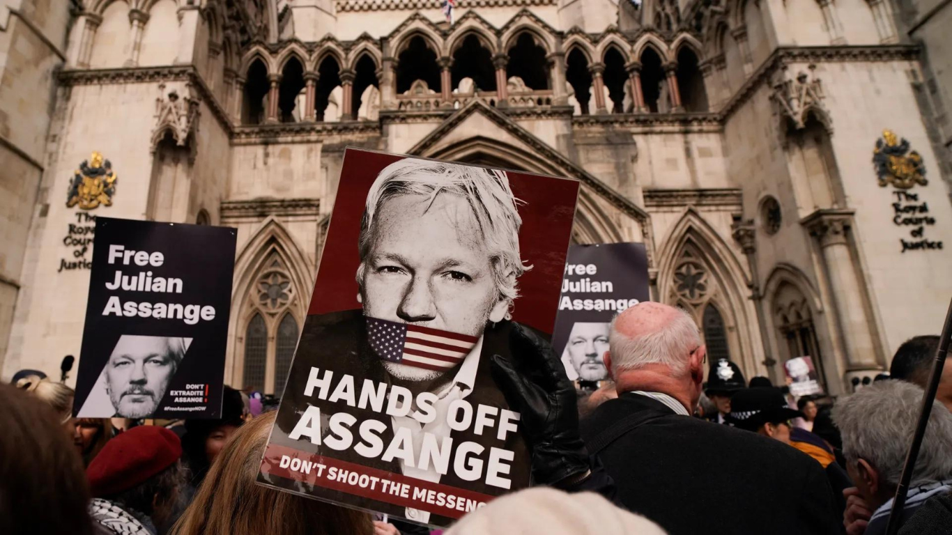 Why Is Julian Assange En Route To Saipan Island?