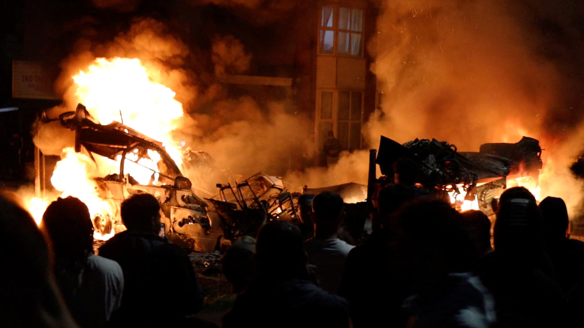 Unrest in Leeds, UK: Police Car Overturned, Bus Set Ablaze as Chaos Erupts in Harehills