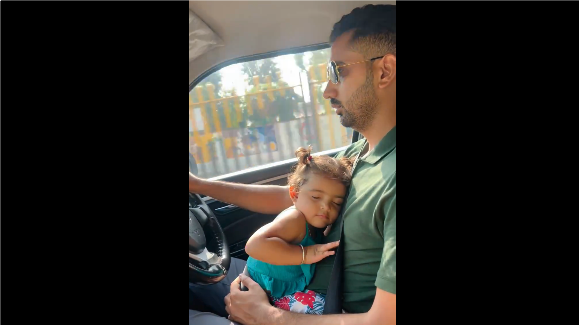 Watch: Viral Video of Man Driving with Daughter on Lap Sparks Safety Concerns